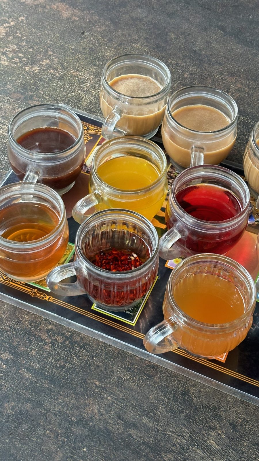 Tasting tray of twelve coffees and herbal teas
